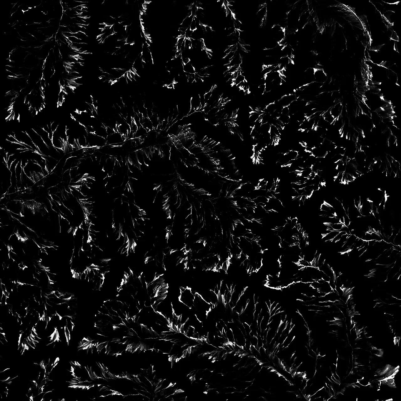 A gravel distribution mask, mostly black, with bright fans of scree spreading below the steeper slopes.