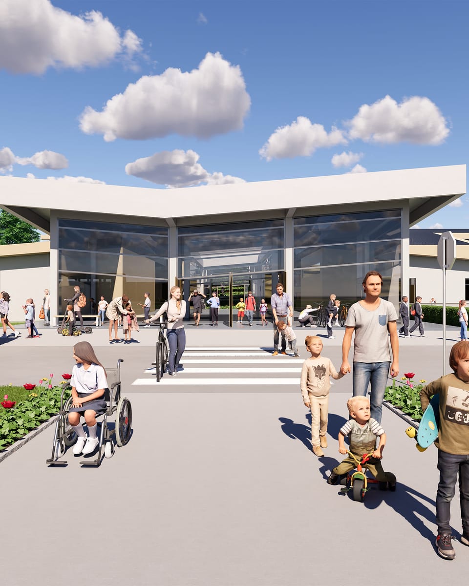 An elementary school entrance on a clear day. A white folded-plate canopy floats over a fully glazed lobby, two yellow school buses stand at either side, and children and parents cross a tulip-lined path towards a striped crossing.