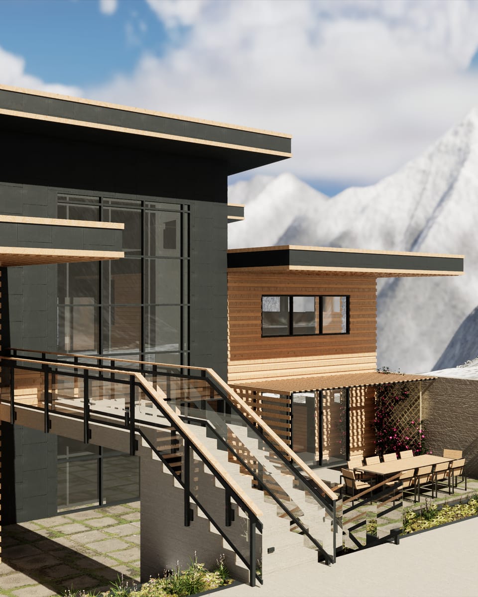 A two-storey house in daylight, dark stone volumes set against wide bands of pale timber cladding, with a steel-and-glass stair running down to a terrace and dining table. Snow-covered peaks rise behind it under broken cloud.