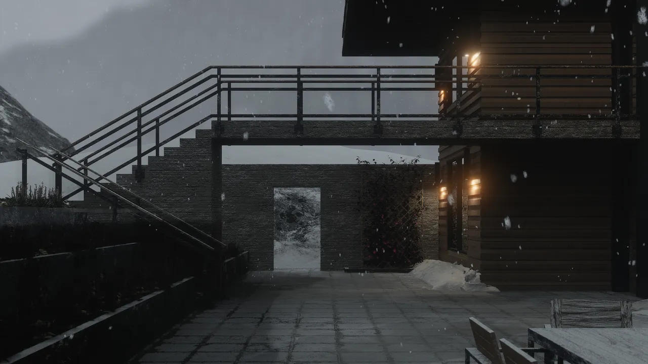 A paved courtyard beneath the house at dusk in falling snow, the stair and walkway crossing overhead, warm interior lights and a flowering trellis on the right, and a lit opening in the wall framing the snow beyond.